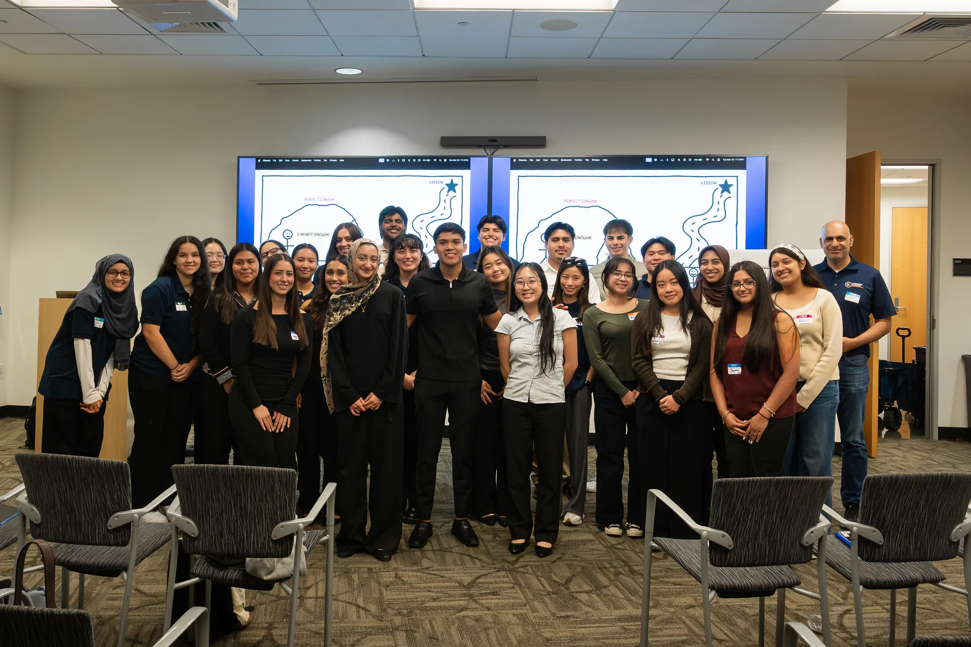 Eliam with students after a workshop at Cal State Fullerton